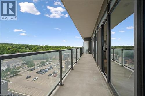 Expansive balcony featuring concrete flooring and a modern glass railing - 50 S Grand Avenue S Unit# 1002, Cambridge, ON - Outdoor With View With Exterior