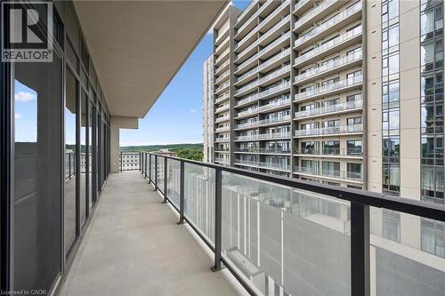 Expansive balcony featuring concrete flooring and a glass railing system - 50 S Grand Avenue S Unit# 1002, Cambridge, ON - Outdoor With Exterior