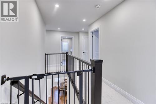 Upper-level hallway with carpeted flooring, recessed lighting, and white walls - 71 Ian Ormston Drive, Kitchener, ON - Indoor Photo Showing Other Room