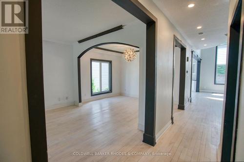 Hallway of the main floor w/living/dining on left - 32 Catterick Crescent, Ottawa, ON 