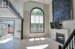 Family room with large crescent window - 