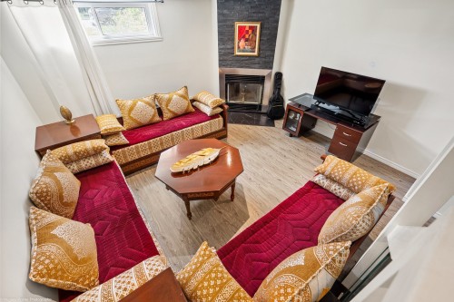 Family Room - C-252 Boul. J.-A.-Paré, Repentigny (Le Gardeur), QC - Indoor Photo Showing Living Room With Fireplace