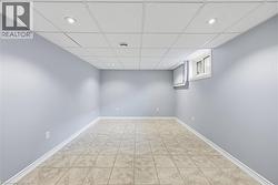 Unfurnished room featuring a paneled ceiling and recessed lighting - 