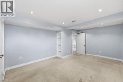 Unfurnished bedroom featuring light colored carpet and recessed lighting - 