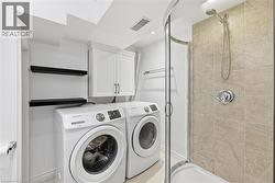 Laundry area featuring independent washer and dryer - 