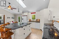 Granite surfaces, gas stove & loads of storage. - 