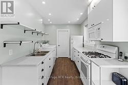 Fully functional kitchen & 2nd laundry area. - 