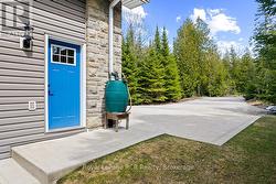 Concrete driveway in front of attached garaged. - 