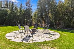 Circular flagstone patio fire-pit area. - 