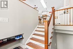 Enter foyer with cubby storage & solid wood stairs - 