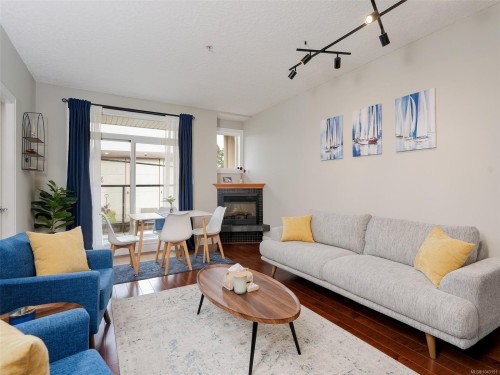 #204-76 Gorge Rd West, Saanich, BC - Indoor Photo Showing Living Room With Fireplace