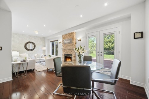 901 Knotty Pine Grove, Mississauga, ON - Indoor Photo Showing Dining Room With Fireplace