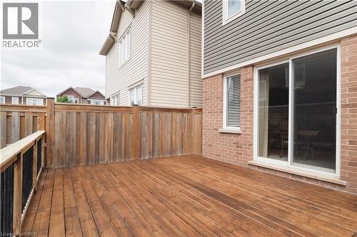Spacious wood deck with a privacy fence - 213 Seabrook Drive, Kitchener, ON 