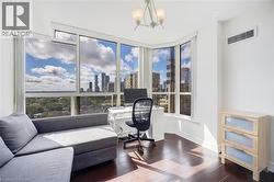 Floor-to-ceiling windows offer expansive city and sky scenery - 