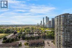 Expansive urban landscape featuring a high-rise residential building, a tree-lined residential area, a commercial thoroughfare, and a distant city skyline - 