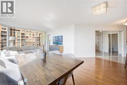 Hardwood-style flooring throughout with expansive window walls - 