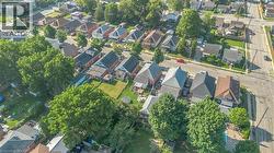 Residential neighborhood featuring varied architectural styles and abundant mature trees - 