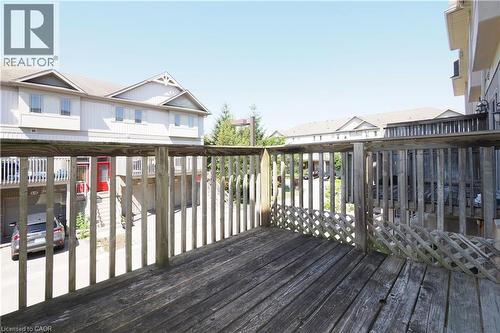 Private wooden deck featuring slatted railings and lattice detailing - 619 Wild Ginger Avenue Unit# H47, Waterloo, ON - Outdoor With Deck Patio Veranda