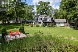 East Side of Property with Pond and Deck - 