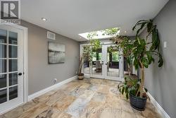 Family Room with Skylight & Walk-out to Solarium - 