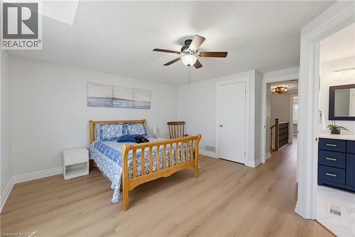 Bright room featuring wood-finish flooring, a ceiling fan, and white walls - 520 Mayflower Street, Waterloo, ON - Indoor Photo Showing Bedroom