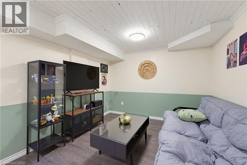 Finished living space featuring wood-finish flooring, recessed ceiling lighting, and a two-tone painted wall design - 520 Mayflower Street, Waterloo, ON - Indoor