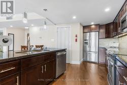 View of Laundry Room Door to Left of Fridge - 