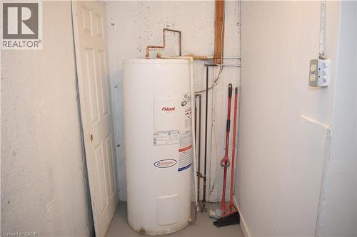 White water heater with visible copper piping - 249 Cedarbrae Avenue Unit# 1, Waterloo, ON 