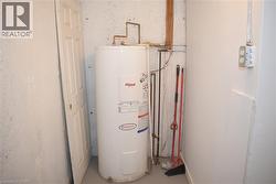 White water heater with visible copper piping - 
