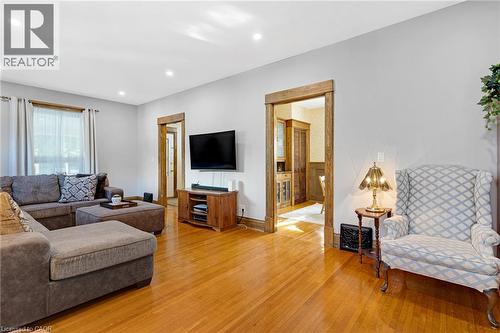 Hardwood-finish flooring extending throughout, complemented by recessed lighting and natural wood-trim doorways - 630 Lawrence Street, Cambridge, ON - Indoor Photo Showing Living Room
