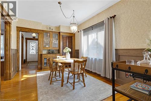 Formal dining area featuring rich wood-finish trim and wainscoting - 630 Lawrence Street, Cambridge, ON - Indoor Photo Showing Dining Room