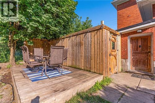 Expansive wood-finish deck with surrounding privacy fencing and mature trees - 630 Lawrence Street, Cambridge, ON - Outdoor With Exterior