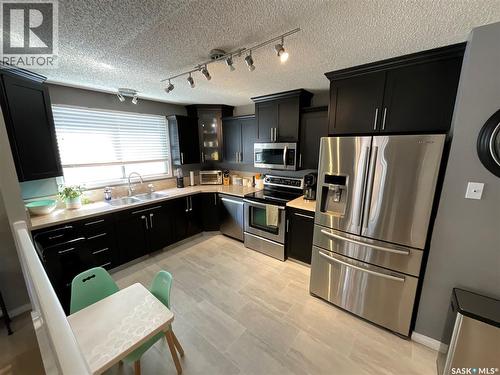 10 Mackenzie Crescent, Regina, SK - Indoor Photo Showing Kitchen With Double Sink