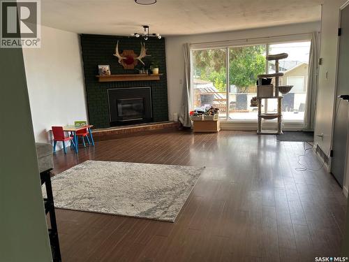1145 9Th Avenue Sw, Moose Jaw, SK - Indoor Photo Showing Living Room With Fireplace