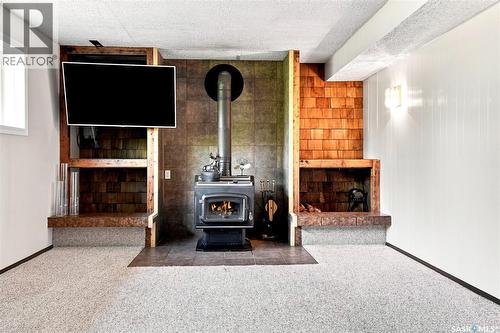 Thorhaug Acreage, Leask Rm No. 464, SK - Indoor Photo Showing Other Room With Fireplace