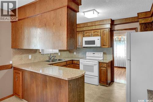 4 Groome Avenue, Regina, SK - Indoor Photo Showing Kitchen With Double Sink