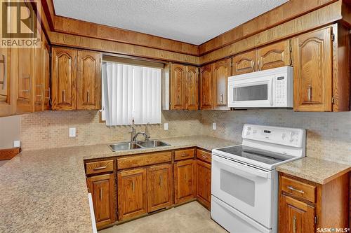 4 Groome Avenue, Regina, SK - Indoor Photo Showing Kitchen With Double Sink