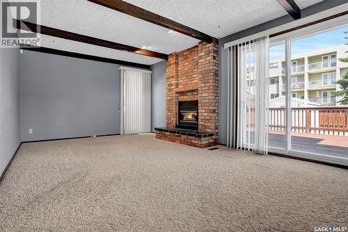 4 Groome Avenue, Regina, SK - Indoor Photo Showing Other Room With Fireplace