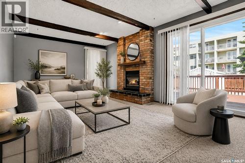 4 Groome Avenue, Regina, SK - Indoor Photo Showing Living Room With Fireplace