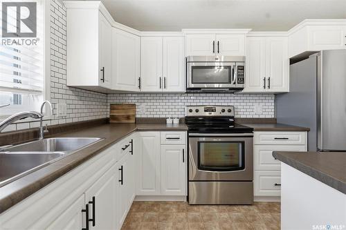310 Martens Avenue, Warman, SK - Indoor Photo Showing Kitchen With Stainless Steel Kitchen With Double Sink