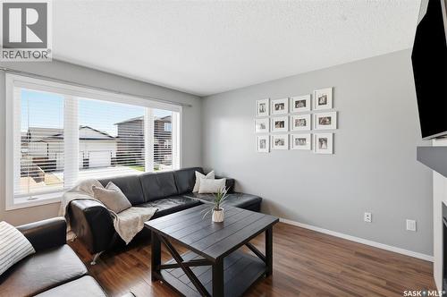 310 Martens Avenue, Warman, SK - Indoor Photo Showing Living Room With Fireplace