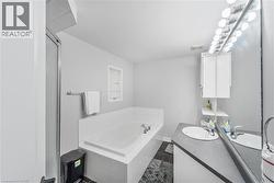 Integrated bathtub with white tile surround - 