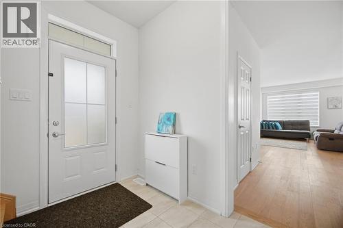Entryway featuring a white door with frosted glass panels, a transom window, and light tile flooring - 240 Velvet Way, Niagara Falls, ON - Indoor Photo Showing Other Room