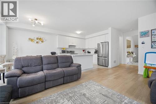 Open-concept living space featuring wood-finish flooring throughout - 240 Velvet Way, Niagara Falls, ON - Indoor Photo Showing Living Room