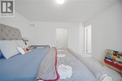 Bright interior space featuring pristine white walls and light carpeting - 240 Velvet Way, Niagara Falls, ON - Indoor Photo Showing Bedroom