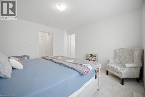 Bright interior room with white walls and light-colored carpeting - 240 Velvet Way, Niagara Falls, ON - Indoor Photo Showing Bedroom