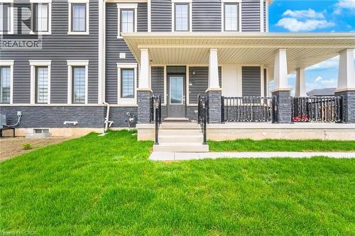 Contemporary exterior featuring dark gray siding and stone veneer - 240 Velvet Way, Niagara Falls, ON - Outdoor With Deck Patio Veranda