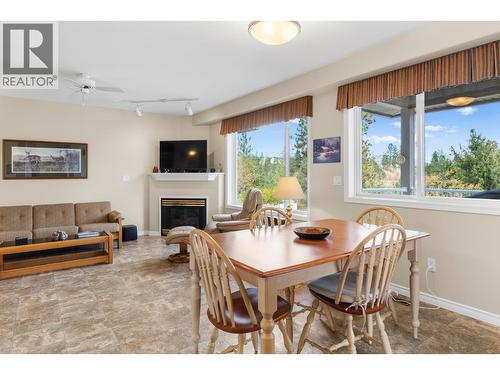 3849 Glen Canyon Drive, West Kelowna, BC - Indoor Photo Showing Dining Room With Fireplace