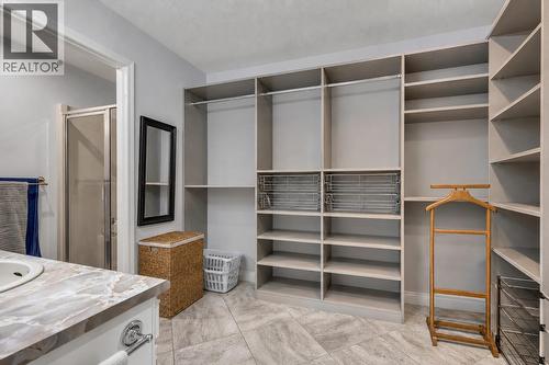 Virtually Staged - 103 Eagle Drive, Kaleden, BC - Indoor With Storage