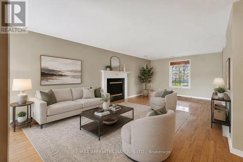 Virtually Staged - 315 Eleventh Street E, Cornwall, ON - Indoor Photo Showing Living Room With Fireplace